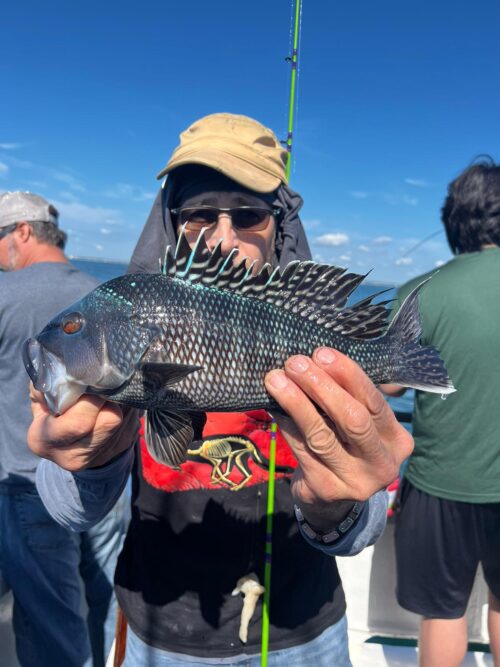 a person holding a fish